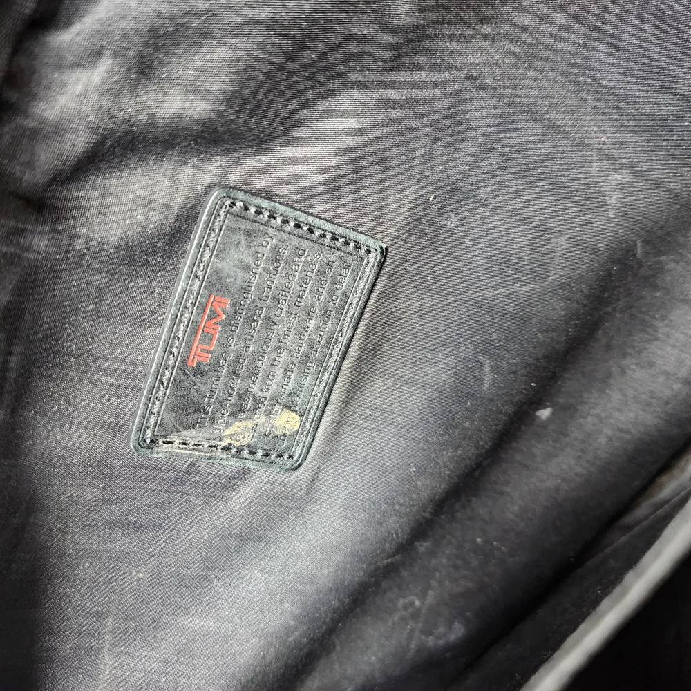 TUMI Black Briefcase with Durable Design